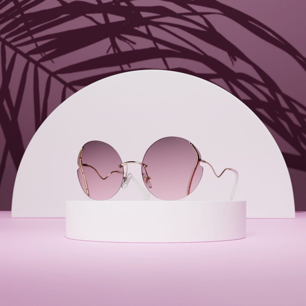 3D render of round sunglasses with pink lenses on a pink pedestal