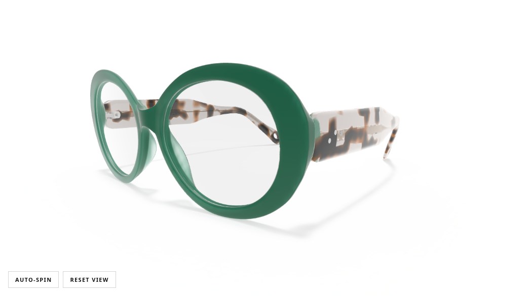 Interactive 3D viewer showing green oval acetate glasses with tortoiseshell temples, with auto-spin and reset controls