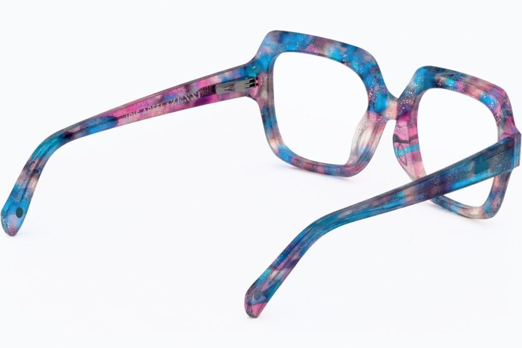 3D render of blue and pink marbled acetate square eyeglasses, angled view